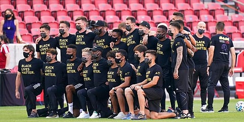 Players of MSL side Los Angeles FC pose for a group photo wearing 'Black Lives Matter' T-shirts prior to their game against Real Salt Lake was called off. (Photo | AP)