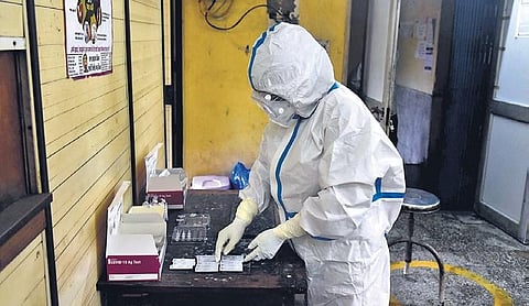A health worker collects swab samples for Covid test on Friday | PARVEEN NEGI