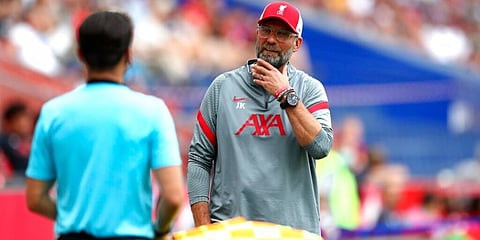 Liverpool's manager Juergen Klopp argues to the referee during a friendly match against RB Salzburg. (Photo | AP)