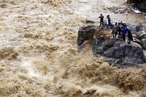 People take pictures of flooded Bagmati river in Nepal in July (File photo | AP)