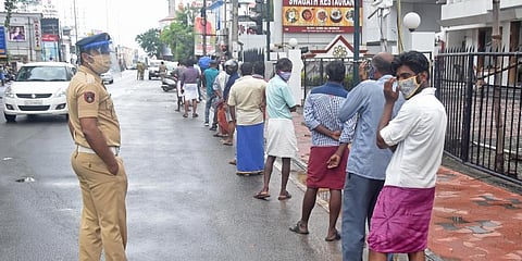 Customers are seen queuing up at the Consumerfed outlet at Statue Junction in Thiruvananthapuram. (Photo | BP Deepu, EPS)