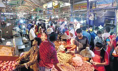 In this file picture of Koyambedu market, people are seen without maintaining social distance and wearing mask