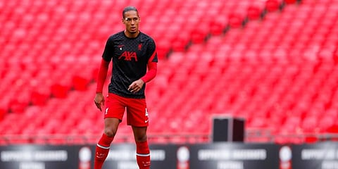 Liverpool's Virgil van Dijk stretches himself during a warmup session. (Photo | AP)