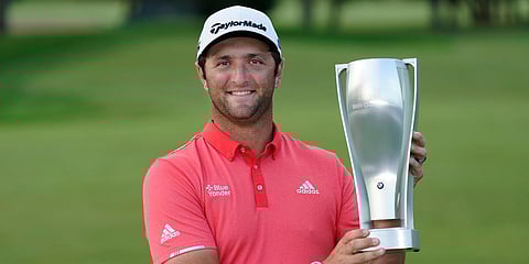 Jon Rahm poses with the BMW trophy after winning the BMW Championship golf tournament at the Olympia Fields Country Club. (Photo| AP)