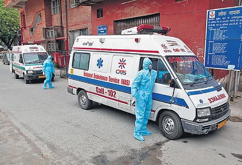 A medical worker waits for COVID-19 patients to arrive at a Delhi hospital. (Photo | Anil Shakya, EPS)