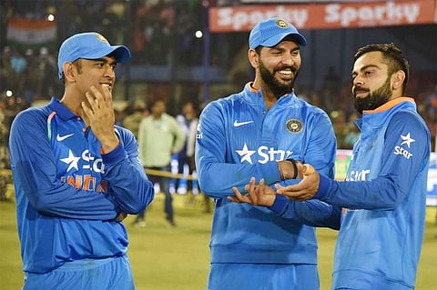 Indian skipper Virat Kohli (L) having a casual chat with Yuvraj Singh (C) and MSÂ Dhoni (Photo | AFP))