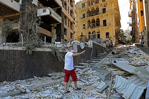 A man inspects the damage of August 4 blast that tore through Lebanon's capital Beirut. (Photo| AFP)