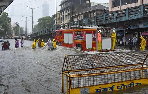 A fire service vehicle crosses a waterlogged street during heavy rains at Byculla area in Mumbai Wednesday Aug. 5 2020. (Photo | PTI)