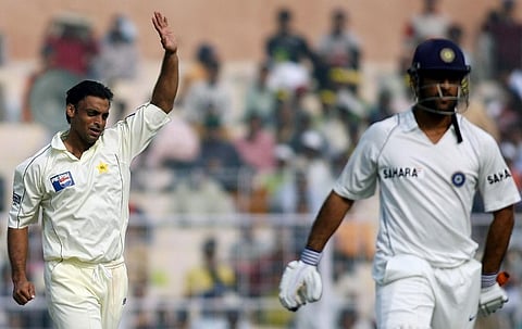 Pakistan's Shoaib Akhtar(L) reacts after taking the wicket of India's Mahendra singh Dhoni. (Photo | AFP)