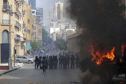People clash with police during a protest against the political elites and the government after this week's deadly explosion at Beirut port. (Photo | AP)
