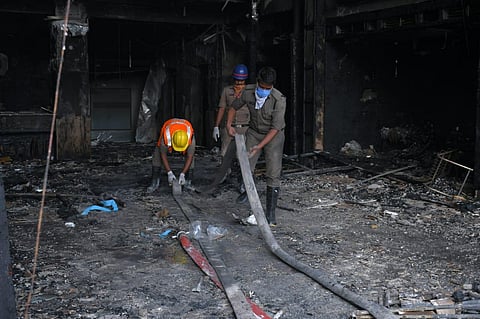 Fire broke out at Swarna Palace where a private hospital took it for treating covid patients in Vijayawada on Sunday. (Photo | Prasant Madugula, EPS)