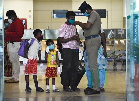 A family shows their E pass at the exit gate of the arrival terminal at Chennai Airport. (Photo | EPS/Ashwin Prasath)