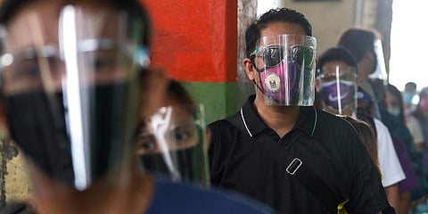 People wearing face mask and face shields to help curb the spread of COVID-19 in Philippines. (Photo | AP)