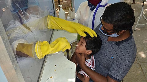 A boy getting Covid test at Fever hospital Covid testing centre in hyderabad on Monday. (Photo | R V K Rao, EPS)