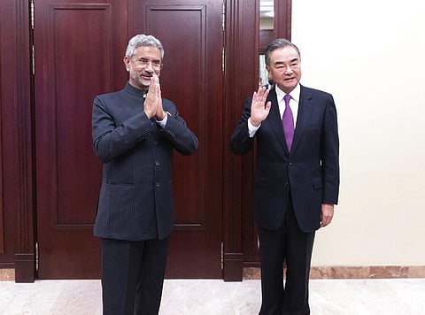ndia's External Affairs Minister Subrahmanyam Jaishankar, left, and Chinese Foreign Minister Wang Yi pose for a photo. (Photo | AP)