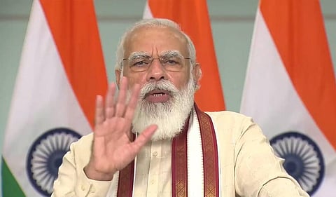 PM Modi speaks while attending the Griha Pravesham program being held in Madhya Pradesh. (Photo | Twitter)