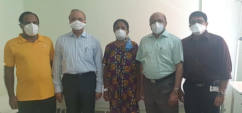 Sindu and her husband with Dr Abi Abraham