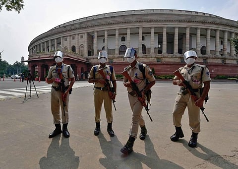 Security Personnel wearing face shields and masks patrol the premises of Parliament House in New Delhi Sunday Sept. 13 2020. (Photo | PTI)