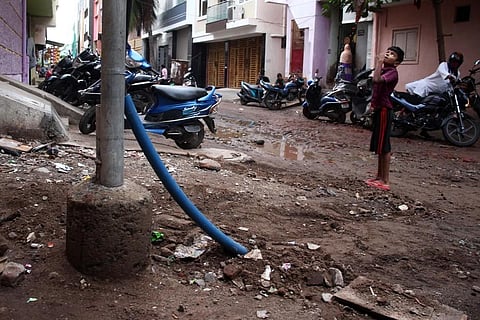 Local residents said both the city corporation and Tangedco do not attend phone calls complaining about such exposed cables. (Photo | EPS, Debadutta Mallick)