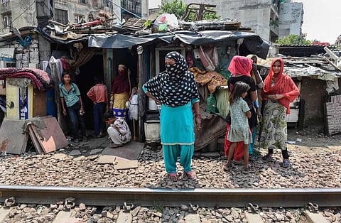 Resident of a slum near Sarai Rohilla Railway line in New Delhi Sunday Sept. 13 2020. (Photo | PTI)