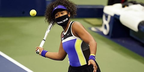 Naomi Osaka wears a mask in honor of Breonna Taylor, during the first round of the US Open. (Photo | AP)