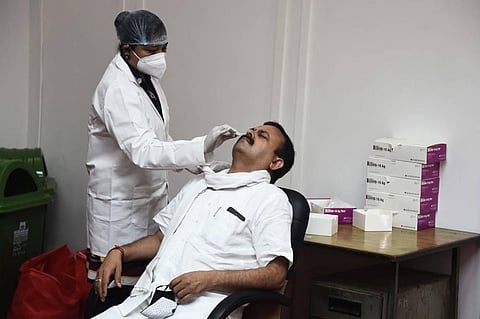 AAP MLA Pawan Sharma undergoes COVID-19 testing at Vidhan Sabha in New Delhi on Monday Sept. 14 2020. (Photo | Parveen Negi/EPS)