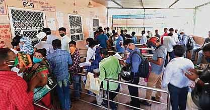 People queue up at the office of Registrar for Births and Deaths ignoring social distancing norms in Bhubaneswar. (Photo | EPS/Irfana)