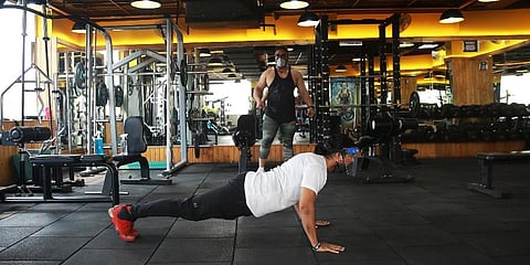 Health enthusiasts work out at a gym in the city (Photo | Shekhar Yadav, EPS)