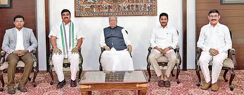 The Governor and Chief Minister with new ministers Srinivasa Venugopalakrishna (R) and Seediri Appalaraju (L) and Deputy CM Dharmana at the Raj Bhavan