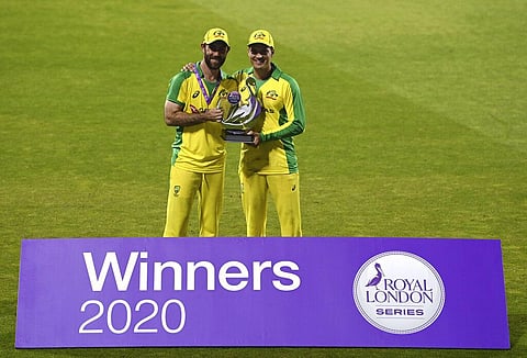 Australia's Glenn Maxwell, left, and Alex Carey pose with the winners trophy after their win in the third ODI cricket match between England and Australia. (Photo | AP)