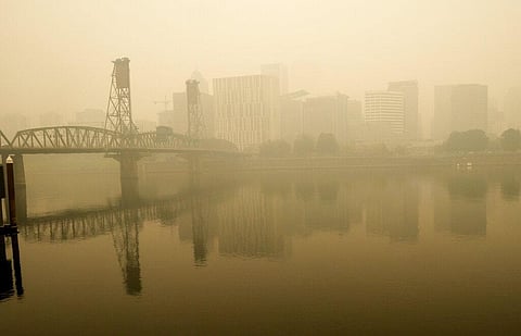 Heavy smoke from wildfires envelops the Willamette Bridge and downtown Portland, Ore., Wednesday, Sept. 16, 2020. (Photo | AP)