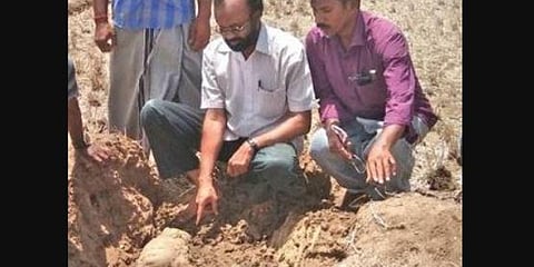 Researchers studying the Chola-era artefacts on Thursday. (Photo | EPS)