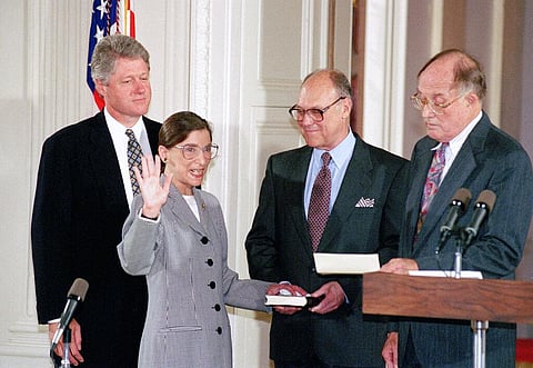 Ruth Bader Ginsburg takes the court oath from Chief Justice William Rehnquist, right, during a ceremony in the East Room of the White House.(Photo | AP)