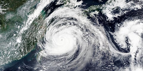 Satellite image released by NASA shows Typhoon Maysak over Japan's southernmost islands, including Okinawa, center. (Photo | AP)