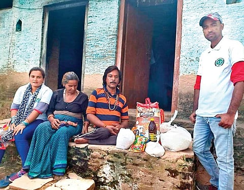Volunteers from Jeevan Katha deliver essentials to a couple;