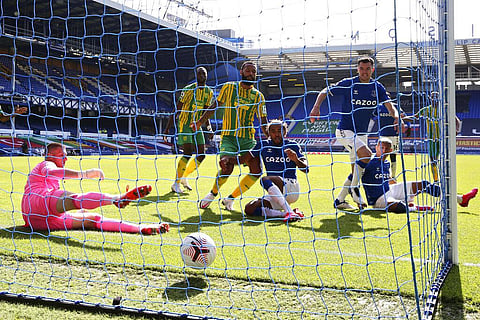 Everton's Michael Keane, foreground right, scores his side's third goal during the English Premier League soccer match between Everton and West Bromwich Albion at Goodison Park. (Photo | AP)