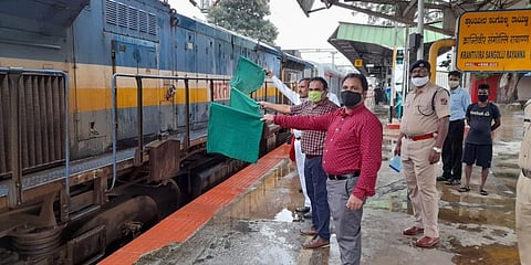 A =N Krishna Reddy (in maroon) and other railway staffers flagging off the first Kisan Rail of Karnataka from Platform 6 of KSR railway station on Saturday evening. (Photo | EPS)