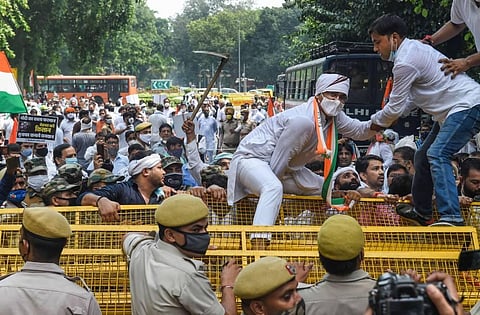 Police stand guard as Congress workers protest against farm bills in New Delhi Monday Sept. 21 2020. (Photo | PTI)