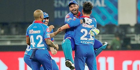Delhi Capitals players celebrate after defeating Kings XI Punjab in the super over during the cricket match of IPL 2020 at Dubai International Cricket Stadium. (Photo | PTI)