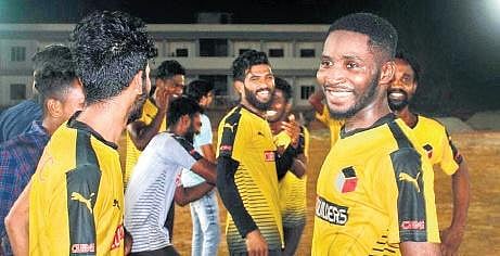 Troare Muhammad with his teammates of a local club