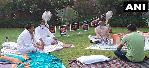 RS Deputy Chairman Harivansh arrives with tea for 8 suspended MPs who camped overnight at Parliament lawns