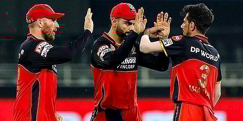 RCB players celebrate the wicket of SRH batsman Manish Pandey during a cricket match of IPL 2020 at Dubai International Cricket Stadium. (Photo | PTI)