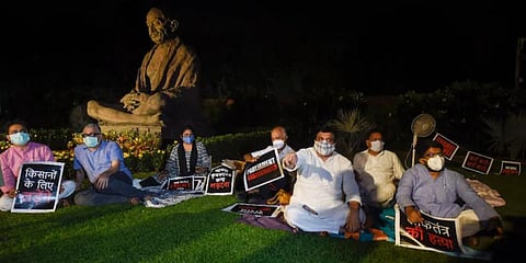 Suspended Rajya Sabha MPs stage protest. (Photo | PTI)