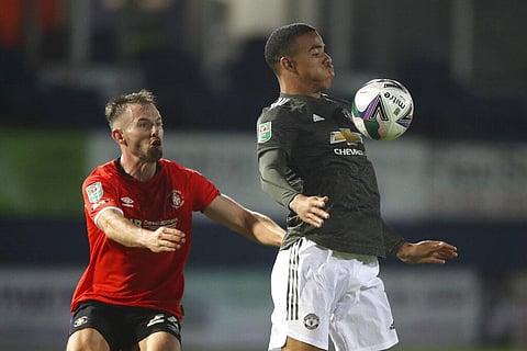 Manchester United's Mason Greenwood, right, during the Carabao Cup 3rd round match between Luton Town and Manchester United. (Photo | AP)