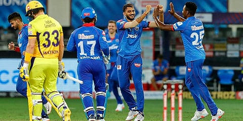 Delhi Capitals bowler Axar Patel celebrates with teammates after dismissing Chennai Super Kings batsman Shane Watson during IPL match at Dubai International Cricket Stadium. (Photo | PTI)