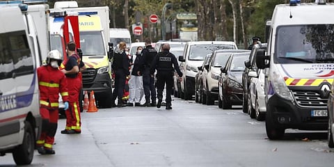 Police at the scene of the knife attack near the former offices of satirical newspaper Charlie Hebdo in Paris. (Photo | AP)