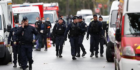 French police officers patrol after four people have been wounded in a knife attack near the former offices of satirical newspaper Charlie Hebdo. (Photo| AP)