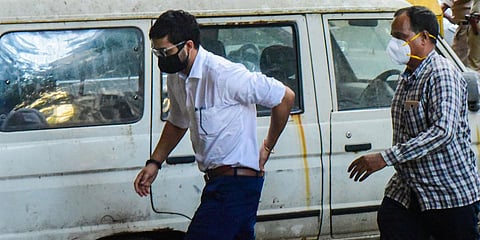 Dharma Productions executive producer Kshitij Ravi Prasad is brought at the NCB office. (Photo| PTI)