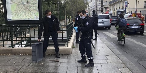 Police officers stand by a knife, seen on the ground, in Paris, Friday, September 25, 2020. (Photo | AP)