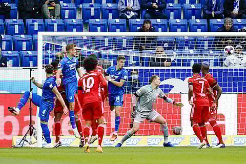 Hoffenheim's scorer Ermin Bicakcic, left, scores the opening goal against Munich goalkeeper Manuel Neuer during the German Bundesliga match. (Photo | AP)